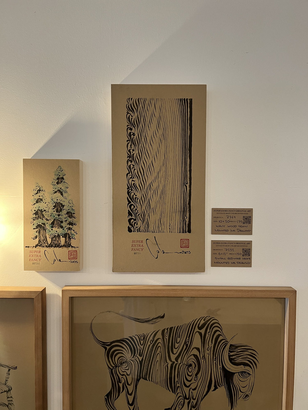 Wavy wood grain drawing #7364 on the SXF wall at Camino Alto, above the framed wood bison drawing